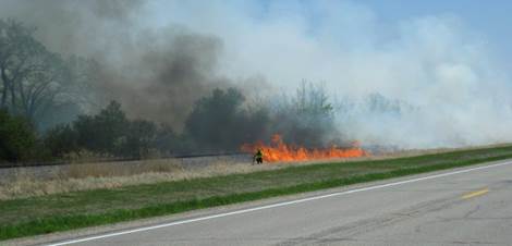 Spring burn along Hwy 75 N of Crookston. When burning along railroad tracks, we first light close to the tracks so that the fire doesn't get a running start and jump over.