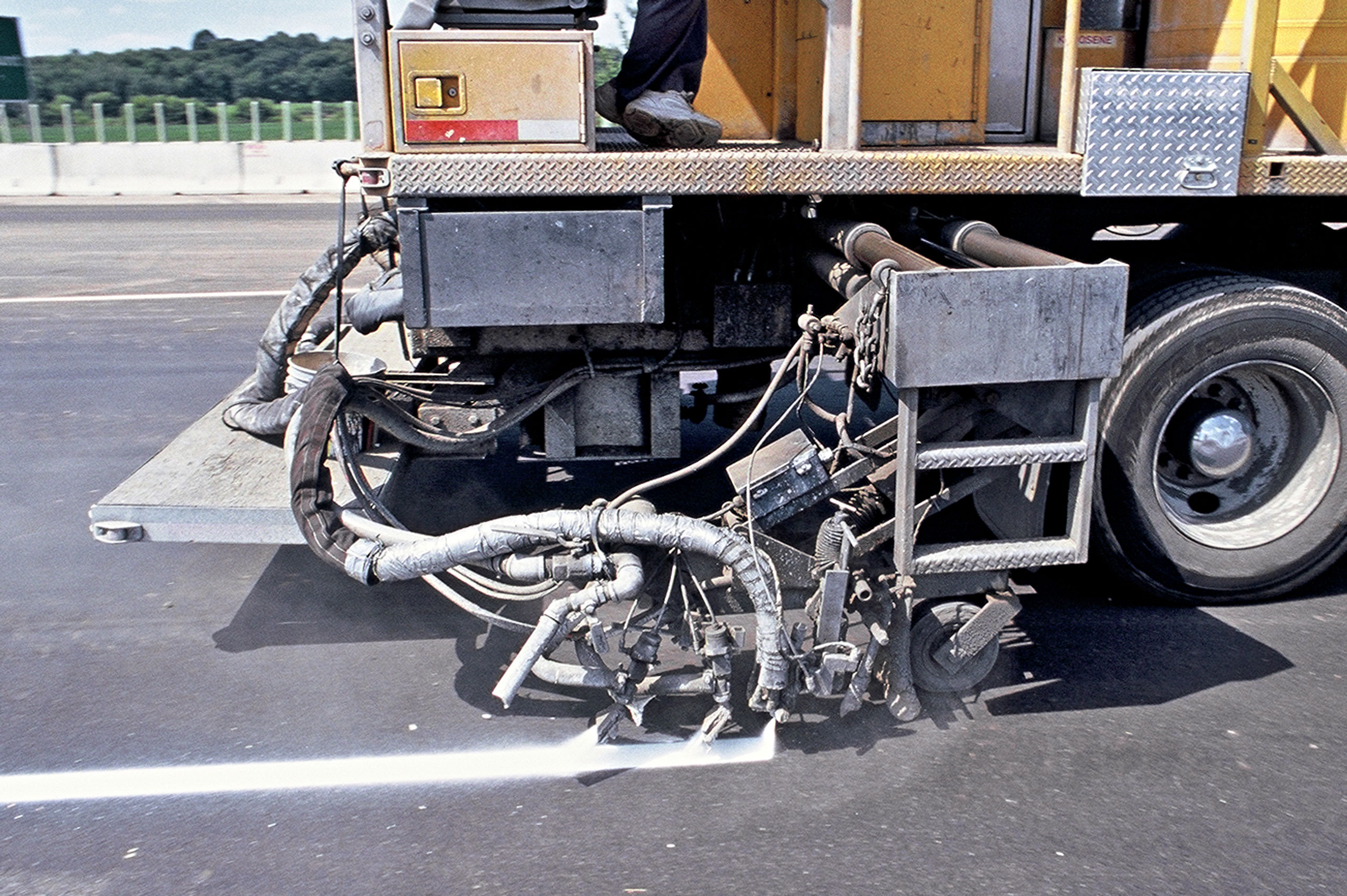 Pavement markings being applied